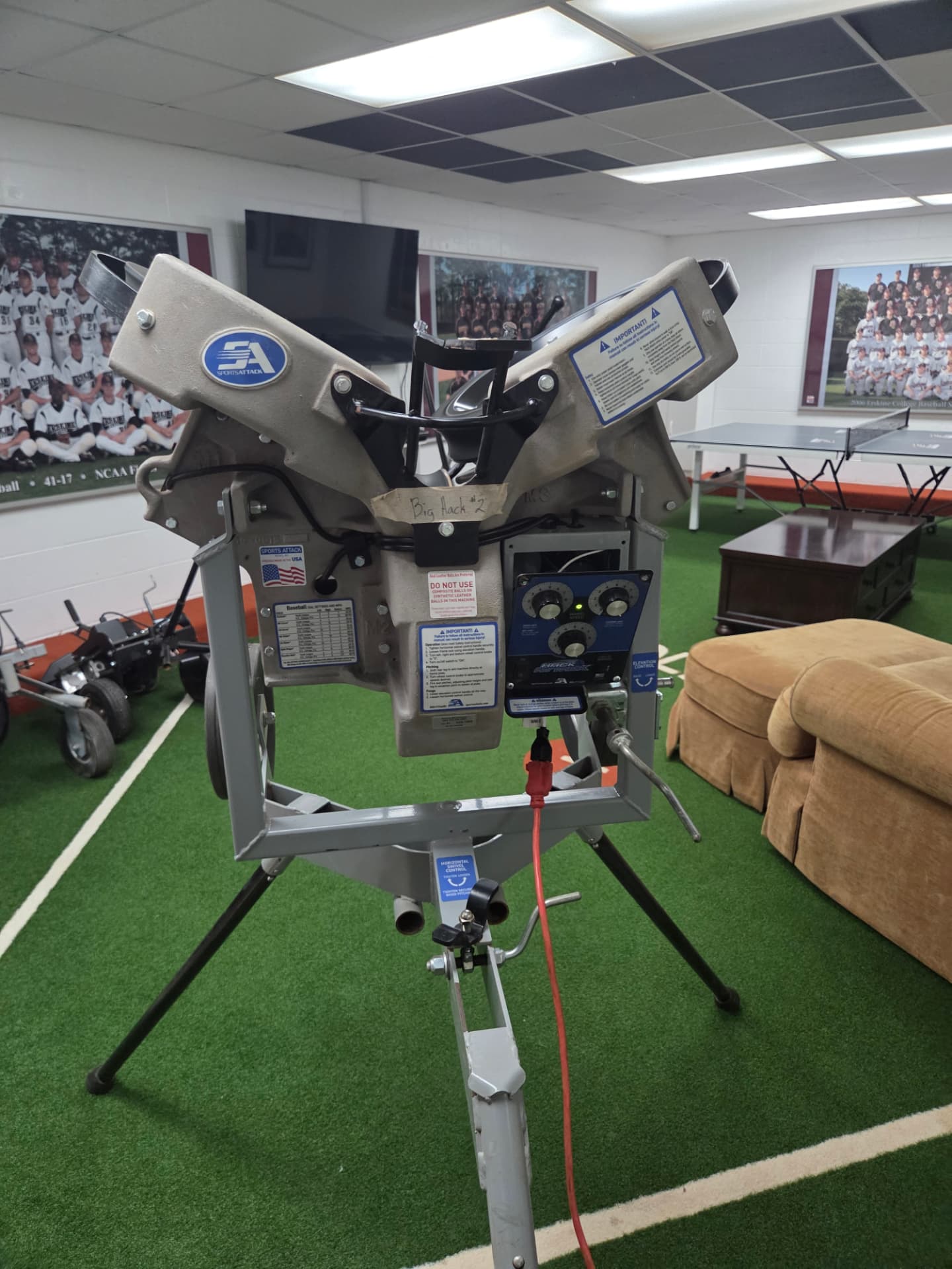 Sports Attack Hack Attack pitching machine set up in a players lounge